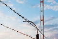 Razor wire. Rusty metal barbered wire on border check point. Wire fence around military or infrastructure objects. Close up of a