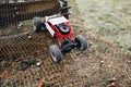 RC crawler riding rough surface og grille Royalty Free Stock Photo