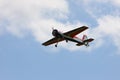 RC model airplane flying in the blue sky Royalty Free Stock Photo