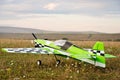 RC model green plane on runway Royalty Free Stock Photo