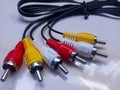 RCA cable, audio and video on white background. Yellow,red and white cable Royalty Free Stock Photo