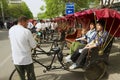 Rckshaw transports passengers at Futong street next to the Houhai lake in Beijing, China.