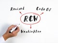 RCW Revised Code Of Washington inscription. Simple and stylish office environment on background Royalty Free Stock Photo