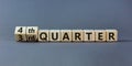 From 3rd to 4th quater symbol. Turned wooden cubes and changed words `3rd quater` to `4th quater`. Beautiful grey table, grey