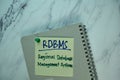 RDBMS - Regional Database Management System write on sticky note isolated on Wooden Table. Business Concept Royalty Free Stock Photo