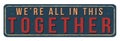 We`re all in this together vintage rusty metal sign Royalty Free Stock Photo