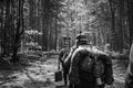 Re-enactors Dressed As German Infantry Soldiers In World War II Marching Walking Along Forest Road In Summer Day. Photo