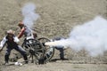 Re-enactors firing a cannon