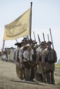 Re-enactors marching