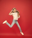 Reach her dream. fly up in air. achievement. excited small girl wear headphones. show dance move. childhood happiness