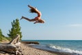 Reach for the Sky and Jump on a Summer Day at Lake Huron Royalty Free Stock Photo