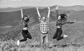 Reached top. Happy cheerful friends celebrate reaching top mountain. Feeling freedom. Man and girls happy emotional Royalty Free Stock Photo