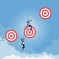 Reaching Higher Targets Concept-Businessman aiming for top goal