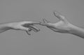 Reaching touching hands. Reach hand. Sensual touch fingers. Two hands trying to touch. Hands of man and woman reaching