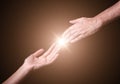 Reaching and touching hands. Royalty Free Stock Photo