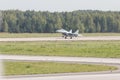 Reactive fighter plane is gaining speed on the runway