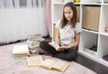 Teenager girl in her room, read a book Royalty Free Stock Photo