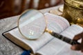 Reading the bible with reading glasses and magnify glass John 3:16