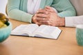 Reading, bible and senior couple holding hands at home with book study and religion together. Prayer, support and Royalty Free Stock Photo