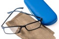 Reading black eyeglasses, brown microfiber cleaning cloth and blue protective case