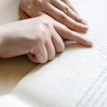 Reading book with braille and usual text Royalty Free Stock Photo