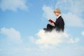 Reading book on the cloud Royalty Free Stock Photo