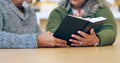 Reading book, hands or old couple with bible in home for faith, religion or God with hope in house. Studying Jesus Royalty Free Stock Photo