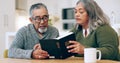 Reading book, old couple or bible in home for faith, religion or God with hope for worship in house. Studying Jesus Royalty Free Stock Photo