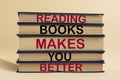 Reading books makes you better-text on a stack of books. The concept of learning new knowledge, self-improvement and development Royalty Free Stock Photo