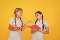 Reading books. Reading and retelling. Small children holding books yellow background. Sincere interest. Little girls Royalty Free Stock Photo