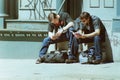 Reading Books, Two Young Men Read Paperbacks On A Stoop