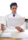 Reading, document and portrait of man doctor in the office for consultation in a medical hospital. Serious, report and Royalty Free Stock Photo