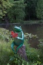 Reading Frog on Tree Stump Royalty Free Stock Photo