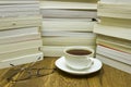 Reading Glasses With Cup Of Tea And Books