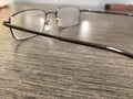 Reading glasses lying on office desk