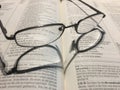 Reading glasses on an open Bible Royalty Free Stock Photo