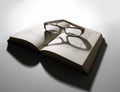 Reading glasses and open book