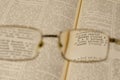 Reading glasses and an open book in close-up. Selective Focus on the word RUSSIAN Royalty Free Stock Photo