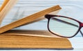 Reading glasses on an open book. Idea for reading books Royalty Free Stock Photo