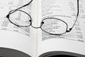 Reading glasses on open business book Royalty Free Stock Photo
