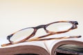 Reading glasses on opened book Royalty Free Stock Photo