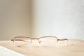reading glasses on a wooden table Royalty Free Stock Photo