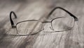 Reading glasses on wooden table Royalty Free Stock Photo