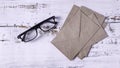 Reading Important Correspondence: Eyeglasses Resting Beside Stack of Brown Envelopes Royalty Free Stock Photo