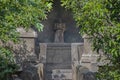 A reading monk statue with day light