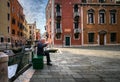 Reading the morning newspaper. Venice old town. Old town squares. The canals and daily life of the old city. Veneto, Italy