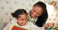 Reading, mother and daughter in bedroom with book, teaching and happy learning time in family home. Knowledge, fantasy Royalty Free Stock Photo