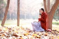 Reading in nature is my hobby,Girl with book and tea in the autumn park Royalty Free Stock Photo