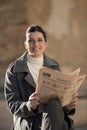 Reading newspaper outdoors Royalty Free Stock Photo