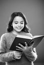 Reading practice for kids. Girl hold book read story over orange background. Child enjoy reading book. Book store Royalty Free Stock Photo